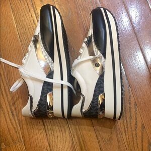 Stylish Black and White Sneakers with Silver Accents